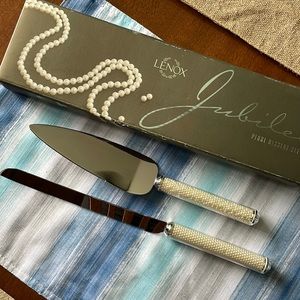 Like new. Lenox Pearl dessert set.